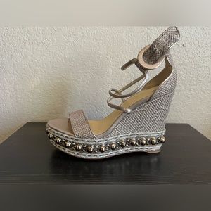 Silver Christian Louboutin studded wedges.